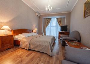 Postel nebo postele na pokoji v ubytování Hotel Palace Ukraine + 37 fotografií