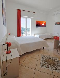Postel nebo postele na pokoji v ubytování B&B Rose Villa