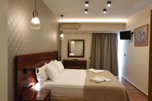 Posteľ alebo postele v izbe v ubytovaní Viaros Hotel Apartments