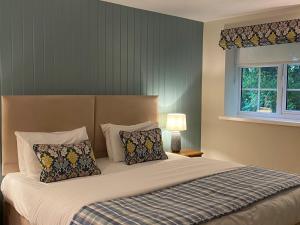 Ein Bett oder Betten in einem Zimmer der Unterkunft Caley Hall