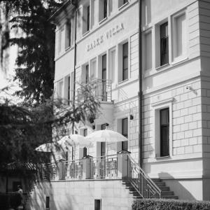 a building with two umbrellas in front of it at BASKE VILLA in Martinske Hole +14 photos