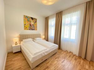 Posteľ alebo postele v izbe v ubytovaní Steiner Residences Vienna Nestroyplatz