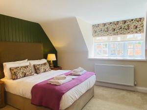 Ein Bett oder Betten in einem Zimmer der Unterkunft Caley Hall