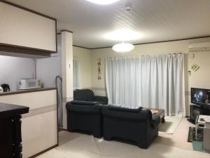 Area tempat duduk di Youyousanso Apartment in Mie