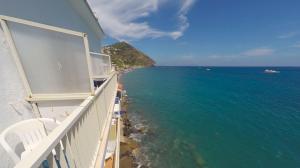 a balcony with a view of the ocean at Hotel Angelino in Ischia