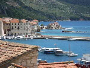a view of a harbor with boats in the water at Komiza Provita Guesthouse in Komiža