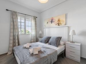 a bedroom with a large bed with two towels on it at Apartment Pueblo Quinta-3 by Interhome in Benalmádena