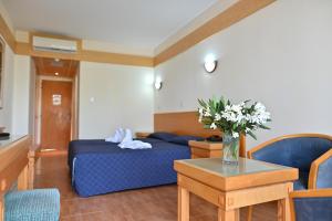 Postel nebo postele na pokoji v ubytování Veronica Hotel