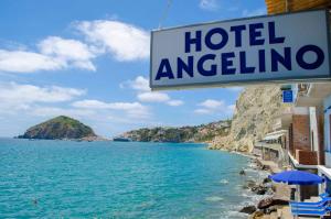 a sign for a hotel overlooking the ocean at Hotel Angelino in Ischia