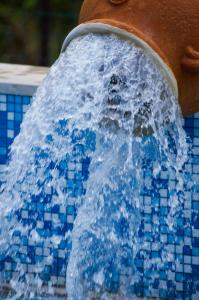 a close up of a water fountain in a pool at Hotel Angelino in Ischia
