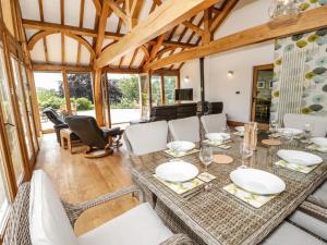 a dining room with a table and chairs at Fron Goch Farm in Abergele