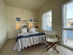 A bed or beds in a room at Villa Marisa - La Guarida