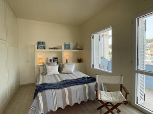 A bed or beds in a room at Villa Marisa - La Guarida