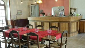 a dining room with a table with wine glasses on it at La Boule d'Or in Bourganeuf