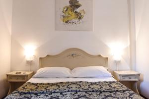 Postel nebo postele na pokoji v ubytování Hotel Terzo Crotto