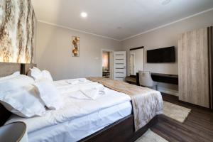 Postel nebo postele na pokoji v ubytování Be my apartman