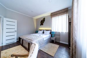 Postel nebo postele na pokoji v ubytování Be my apartman