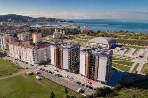 an aerial view of a city with buildings and the water at Delightful Studio Soho City in Bar