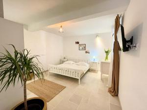 Postel nebo postele na pokoji v ubytování Apartments Rita