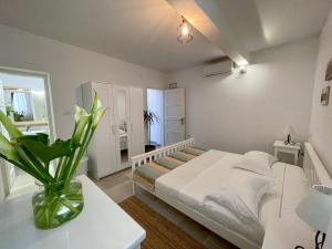 Postel nebo postele na pokoji v ubytování Apartments Rita