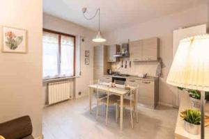 a kitchen with a table and a dining room at La Casina di Nello in Montepulciano +25 photos