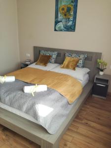 Postel nebo postele na pokoji v ubytování Erdei Szalonka Apartman