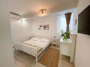Postel nebo postele na pokoji v ubytování Apartments Rita