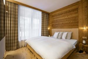 Posteľ alebo postele v izbe v ubytovaní Luxusný Apartmán Kukučka Residence - Tatranské Apartmány
