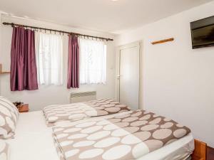 Postel nebo postele na pokoji v ubytování Holiday Home Maja by Interhome