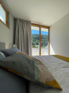 Posteľ alebo postele v izbe v ubytovaní Appartement Schladming Neu