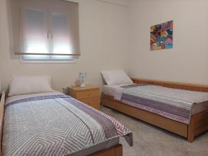 Postel nebo postele na pokoji v ubytování (Apt.4) Lofos Apartments in Vergia Halkidiki