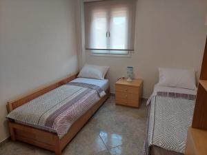 Postel nebo postele na pokoji v ubytování (Apt.4) Lofos Apartments in Vergia Halkidiki