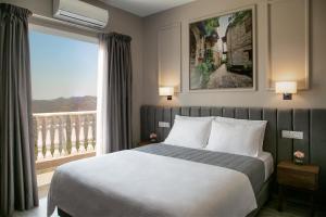 Postel nebo postele na pokoji v ubytování Archontiko Kiverniti + 27 fotografií