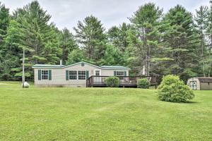 a home with a large yard with a house at Deck, Fire Pit & Yard: Mountain Escape! in Benezette