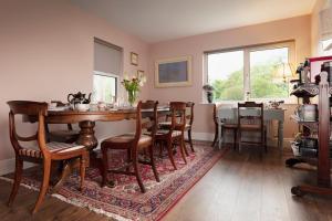 a dining room with a table and chairs at Bridge Street Townhouse in Kenmare