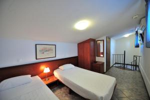 Postel nebo postele na pokoji v ubytování Eye Q Resort Seaview