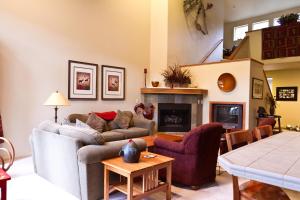 a living room with a couch and a fireplace at Widgi Creek #22 condo in Bend
