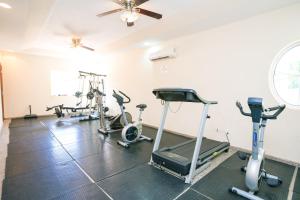 a gym with several treadmills and exercise bikes at Lawson Rock - Angelfish 100 Condo in Sandy Bay