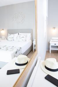 Ein Bett oder Betten in einem Zimmer der Unterkunft Likio Studios