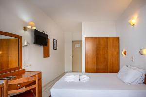 Posteľ alebo postele v izbe v ubytovaní Hotel Kathrin Beach