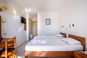 Posteľ alebo postele v izbe v ubytovaní Hotel Kathrin Beach