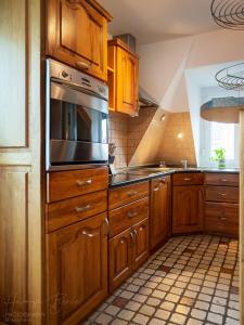 Kuchyňa alebo kuchynka v ubytovaní Moai Home Apartman Sárvár