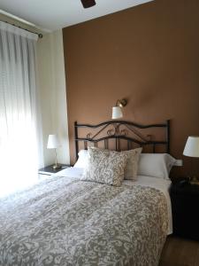 Ένα ή περισσότερα κρεβάτια σε δωμάτιο στο Hostal Plaza