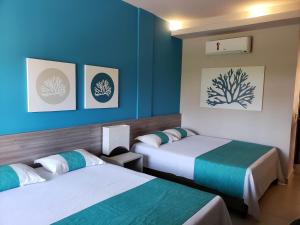 Postel nebo postele na pokoji v ubytování Tabaobí Smart Hotel