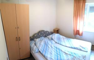 A bed or beds in a room at Babarczi Üdülőház