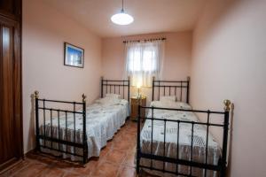 Posteľ alebo postele v izbe v ubytovaní CASA LOS TAJINASTES