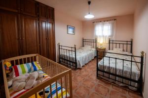 Posteľ alebo postele v izbe v ubytovaní CASA LOS TAJINASTES
