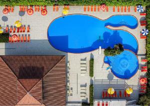 an aerial view of a building with a swimming pool at Hotel Adria in Milano Marittima