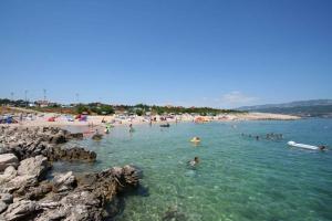 a group of people in the water at a beach at Apartment in Silo/Insel Krk 13562 in Šilo