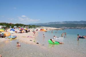 a group of people on the beach at a beach at Apartment in Silo/Insel Krk 13562 in Šilo